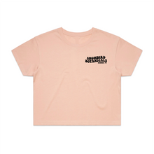 Load image into Gallery viewer, Pink Crop Top with a Groovy font print on the left chest saying &quot;Snowbird Botanicals Barnet, VT&quot;