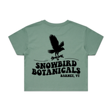 Load image into Gallery viewer, Sage Crop Top with a big design on the back of a snowbird and the text &quot;Snowbird Botanicals Barnet, VT&quot; underneath.