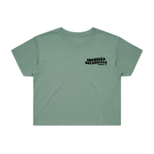 Load image into Gallery viewer, Sage Crop Top with a Groovy font print on the left chest saying &quot;Snowbird Botanicals Barnet, VT&quot;.